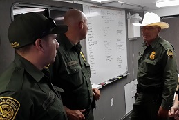 U.S. Border Patrol meets in the command trailer